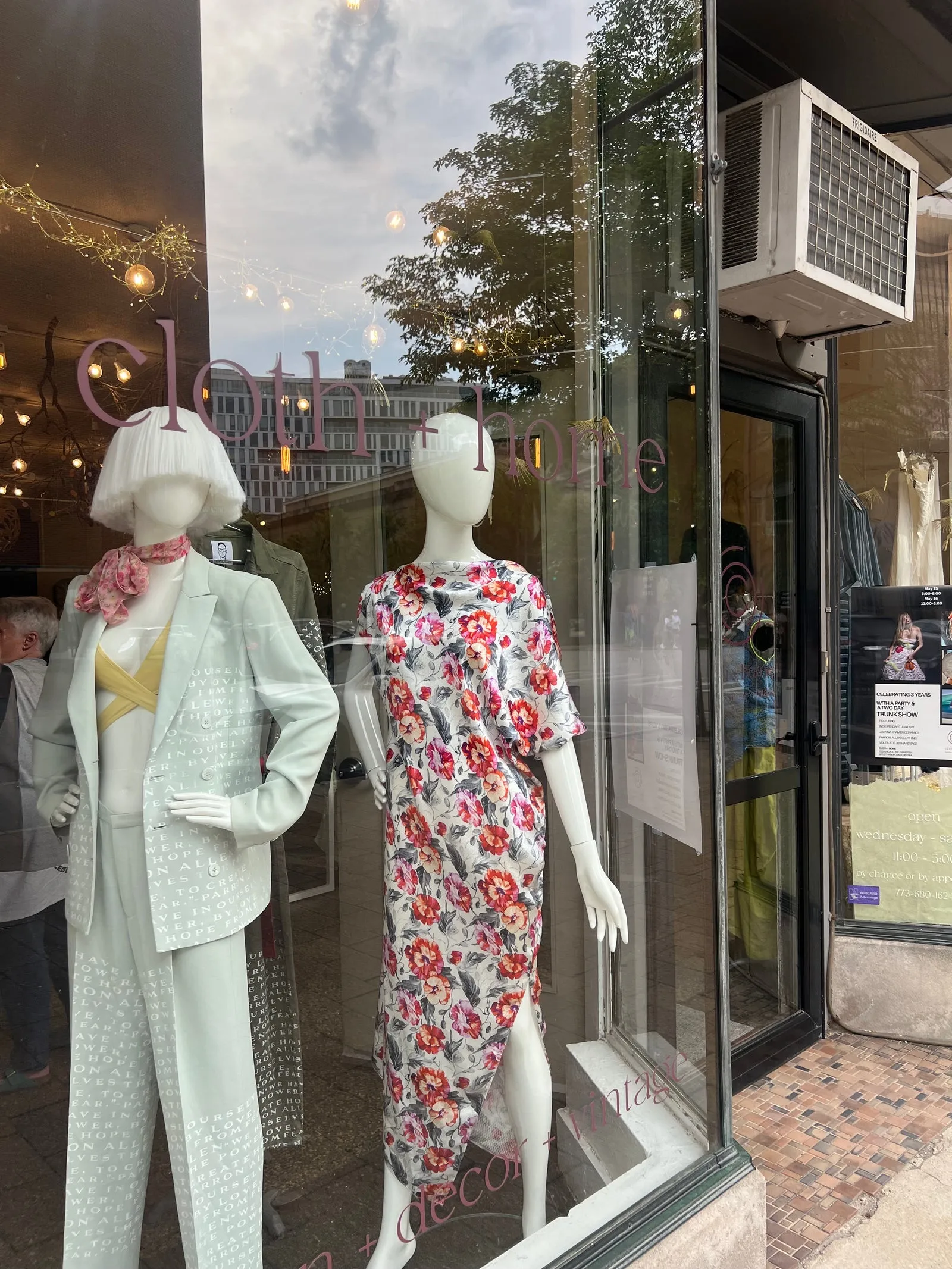 The cloth + home storefront at dusk