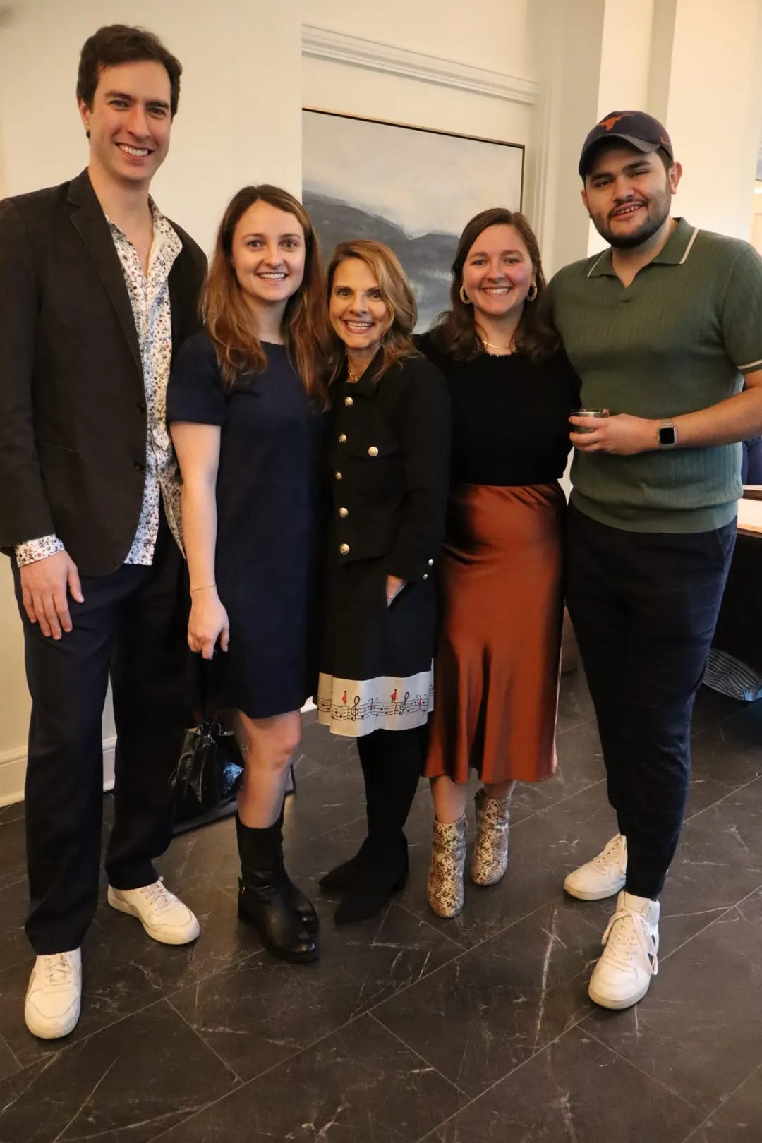 Five guests posed together before the show